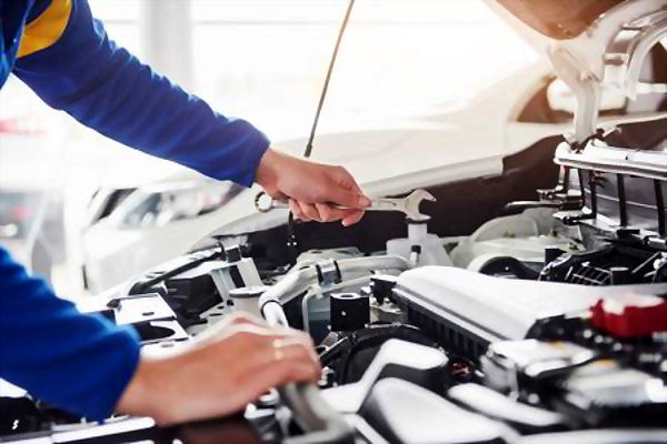 car mechanic fixing the engine